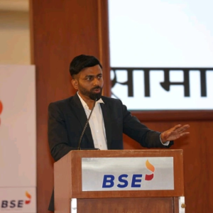 Rajendra Gangan speaking at a podium
